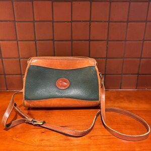 Vintage leather hunter green Dooney and Bourke crossbody purse with brass zipper